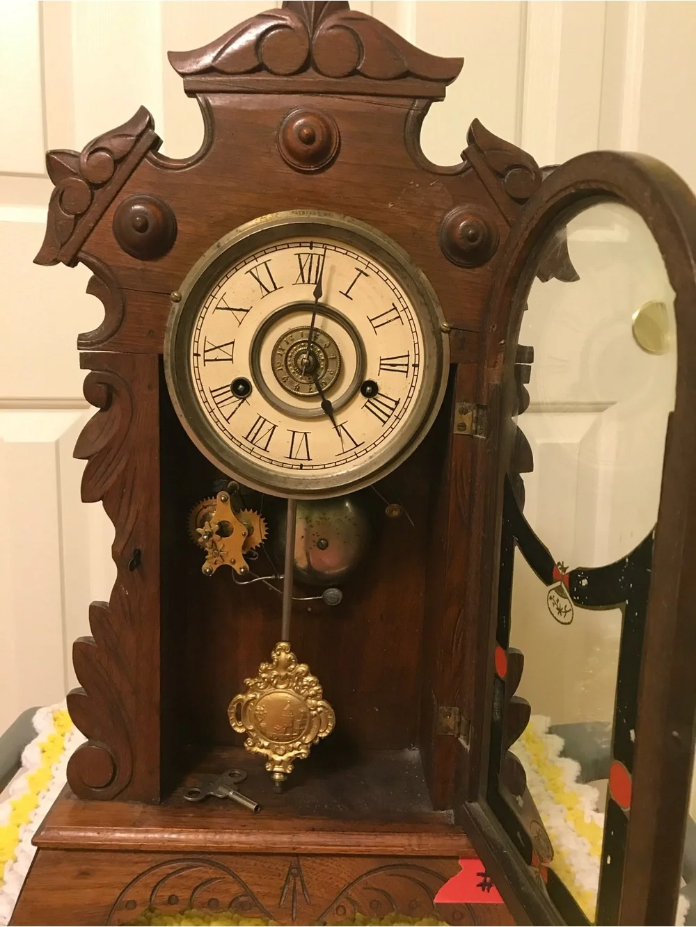 Ornate Brown Wooden Wall Clock with Roman Dial
